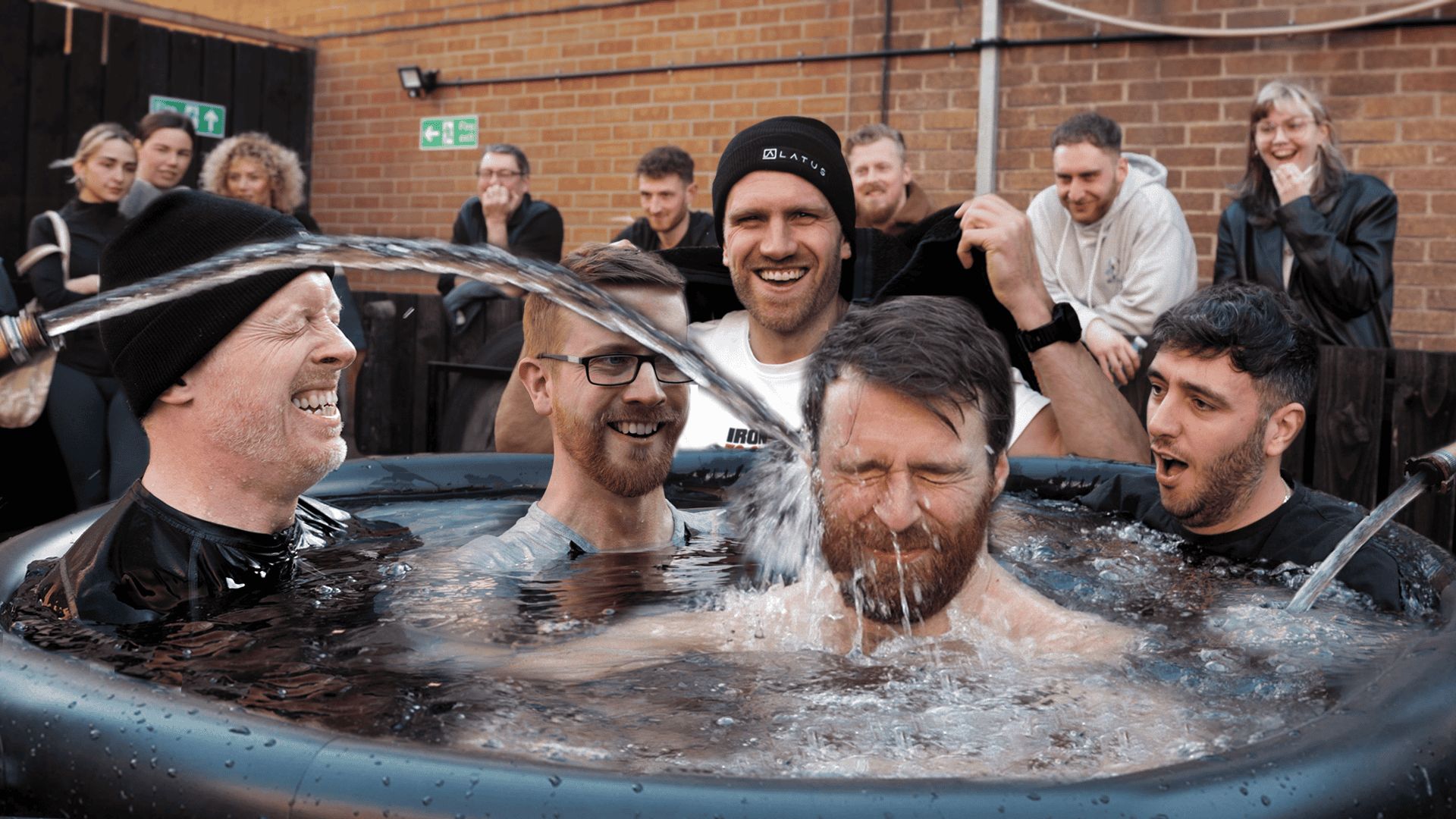 LATUS Group team enjoying a fun outdoor water activity together.