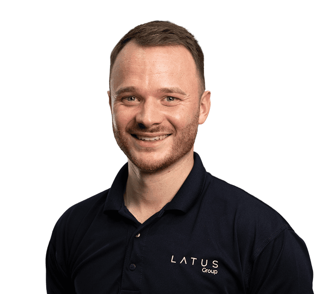 LATUS Group logo on a professional clinic staff member's uniform.