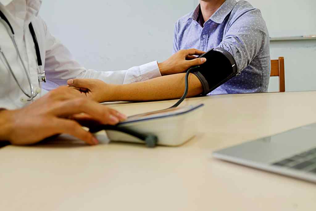 Blood pressure check for employee health surveillance in a clinical setting.