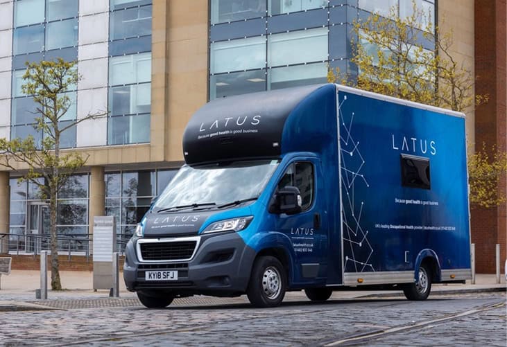 LATUS Group mobile service vehicle in urban setting.