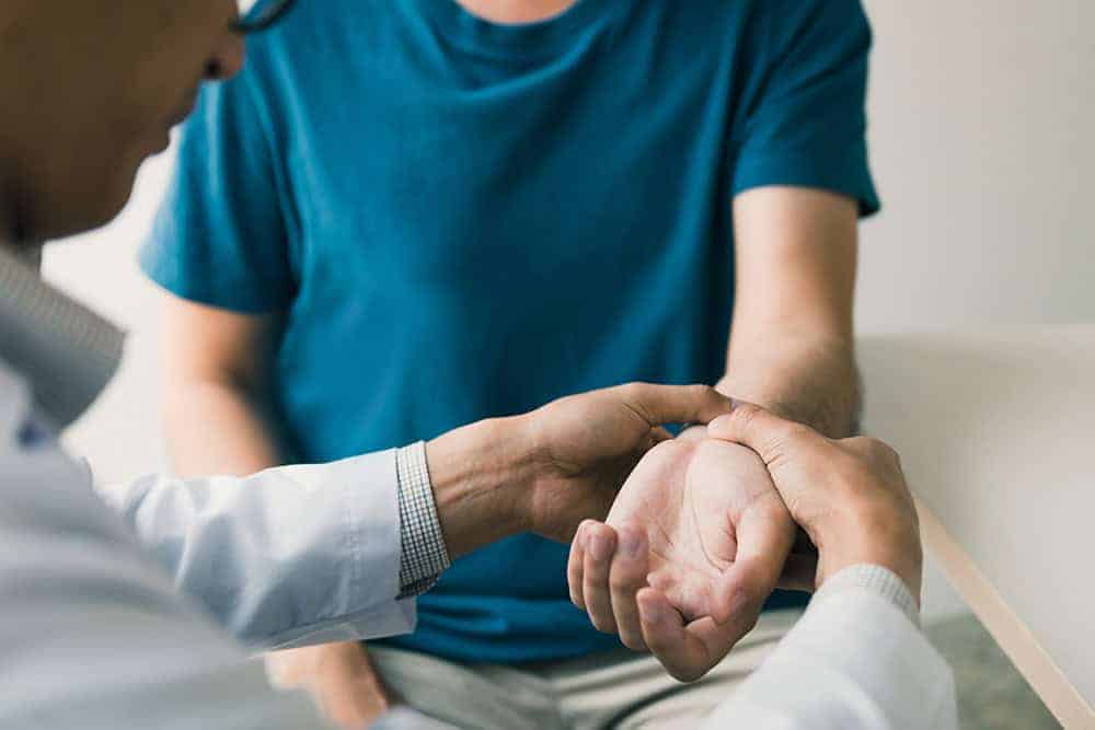 Healthcare professional conducting health surveillance assessment.