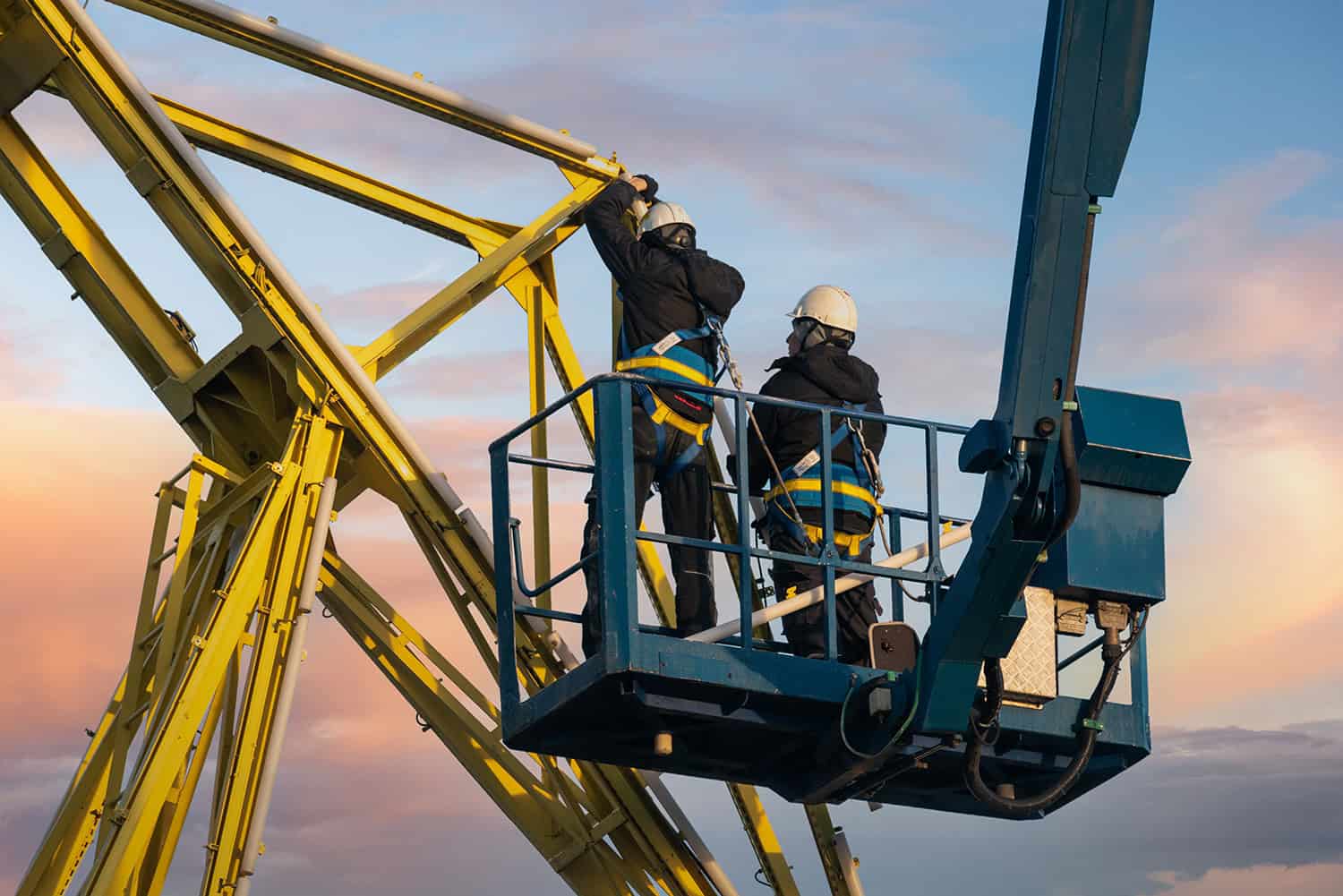 High-risk workers performing safety-critical checks on industrial equipment.