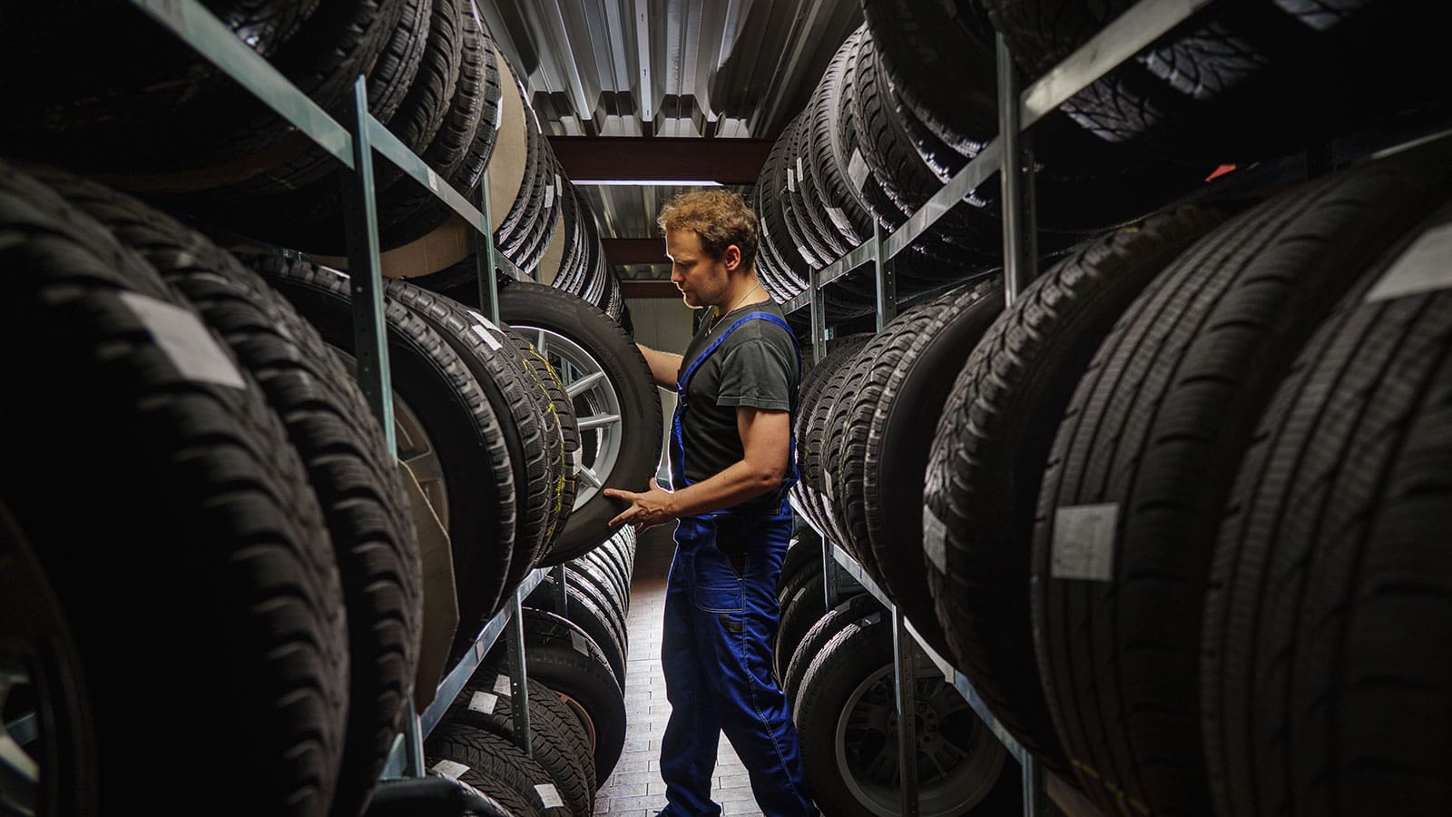 Warehouse with stacked tires at LATUS Group, supporting mental health at work initiatives.