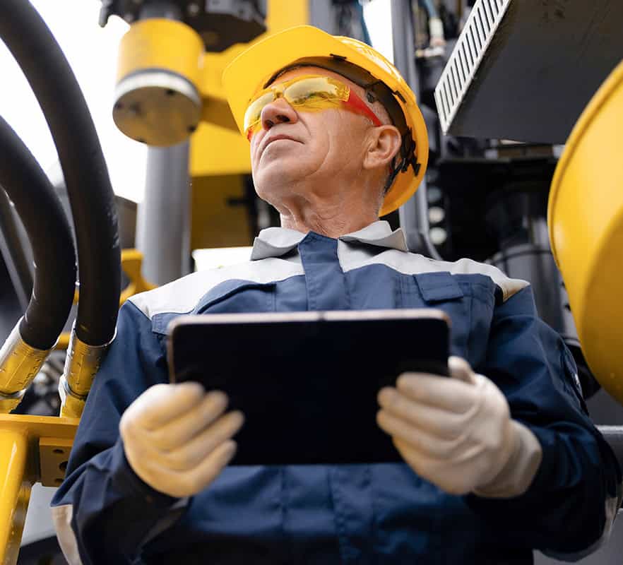 Offshore worker using tablet for health check or safety procedures.