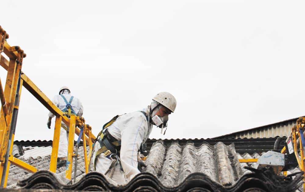 Safety harness and helmet used during roof safety training session.