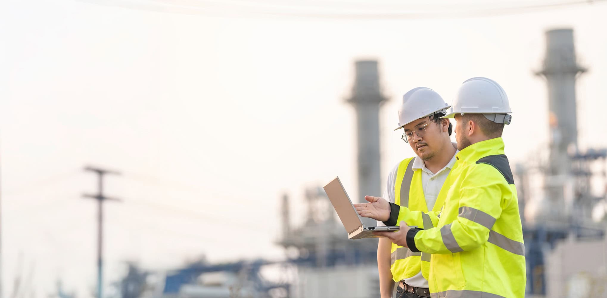 Engineers inspecting ionising radiation safety measures at industrial site.