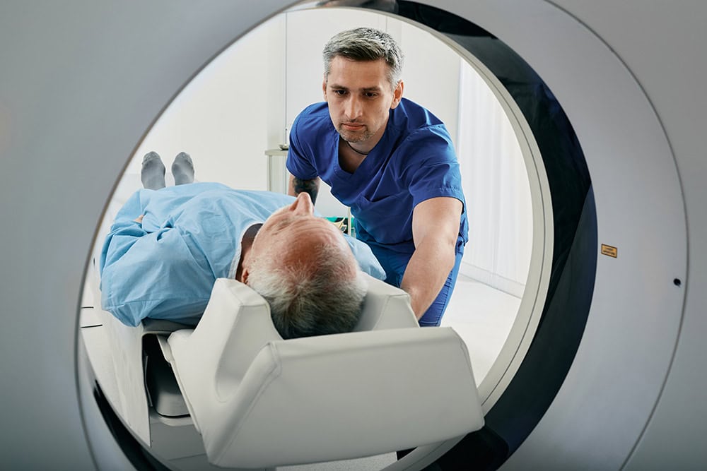 Healthcare professionals performing health surveillance with medical imaging equipment.