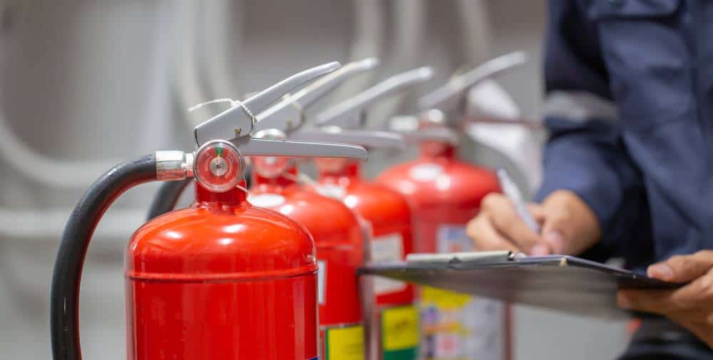 Fire extinguishers used in health and safety training sessions.