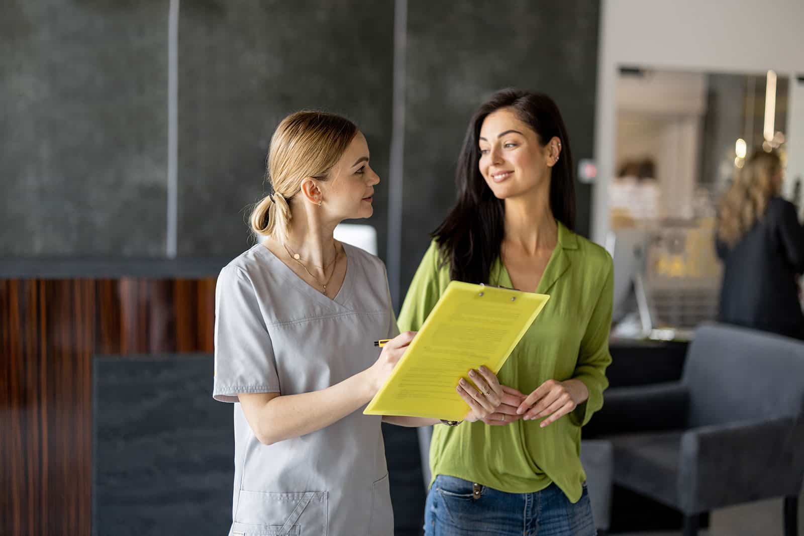 Healthcare professionals discussing pre-employment health screening process.