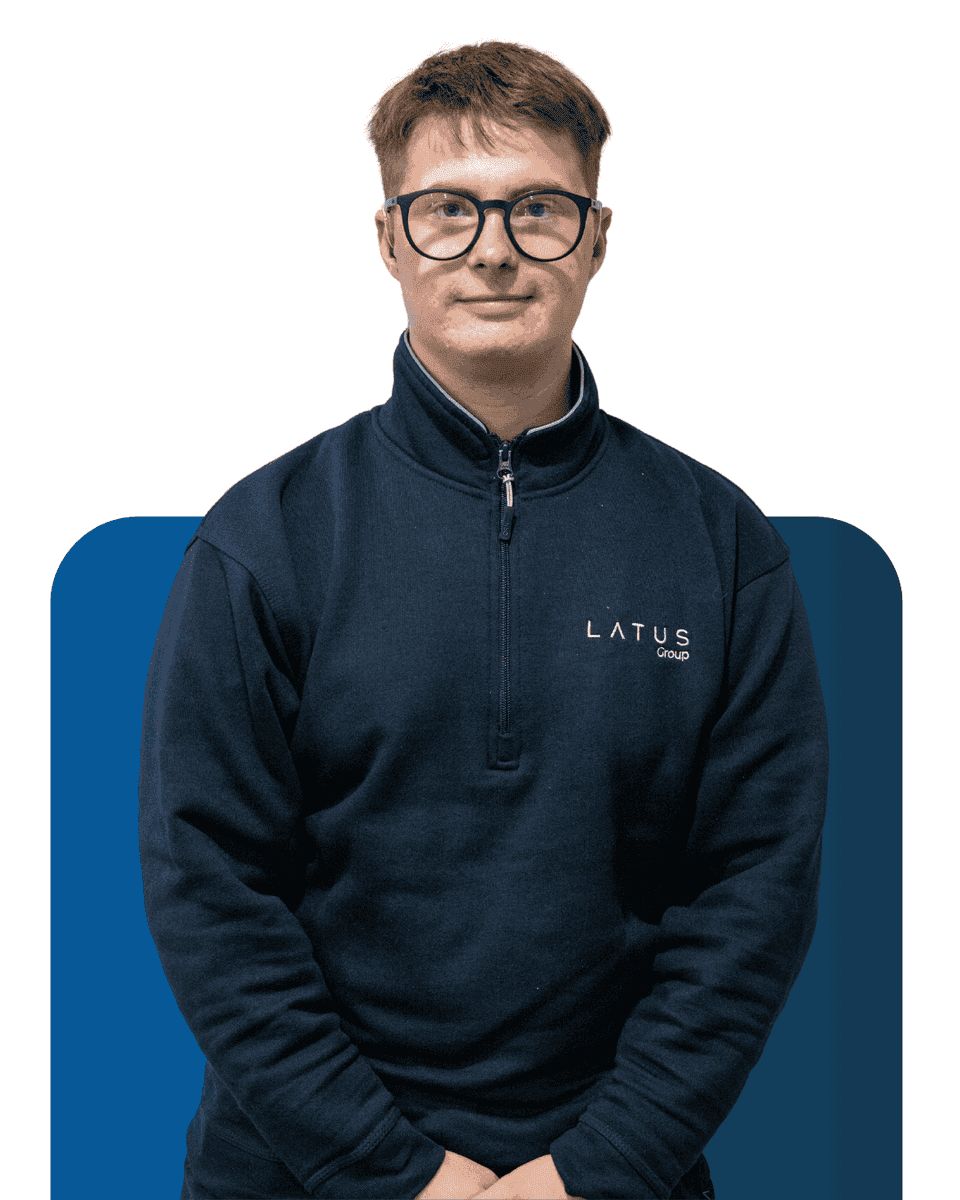 Professional team member at LATUS Group in casual work attire.