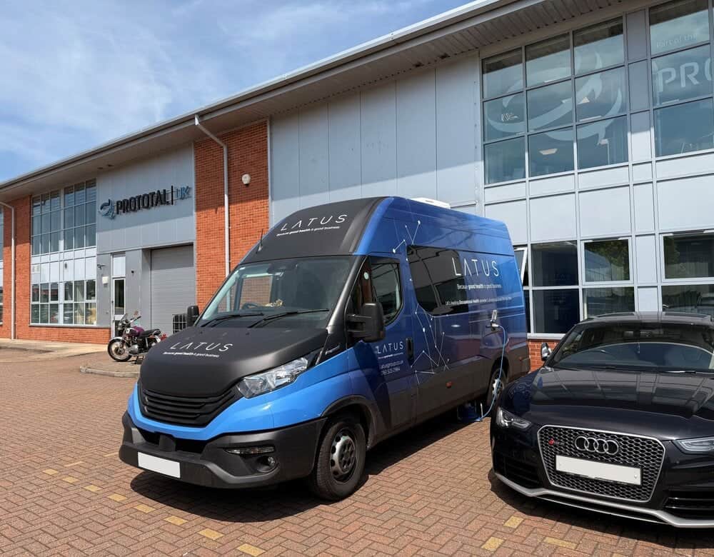 LATUS Group delivery van parked outside a modern building in the UK.