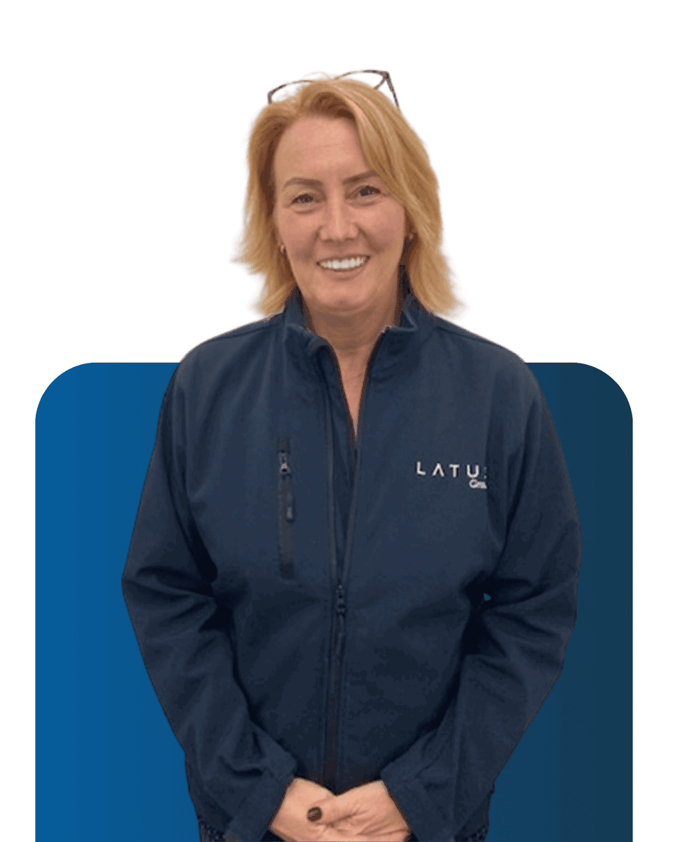 LATUS Group team member in company jacket smiling for the camera.