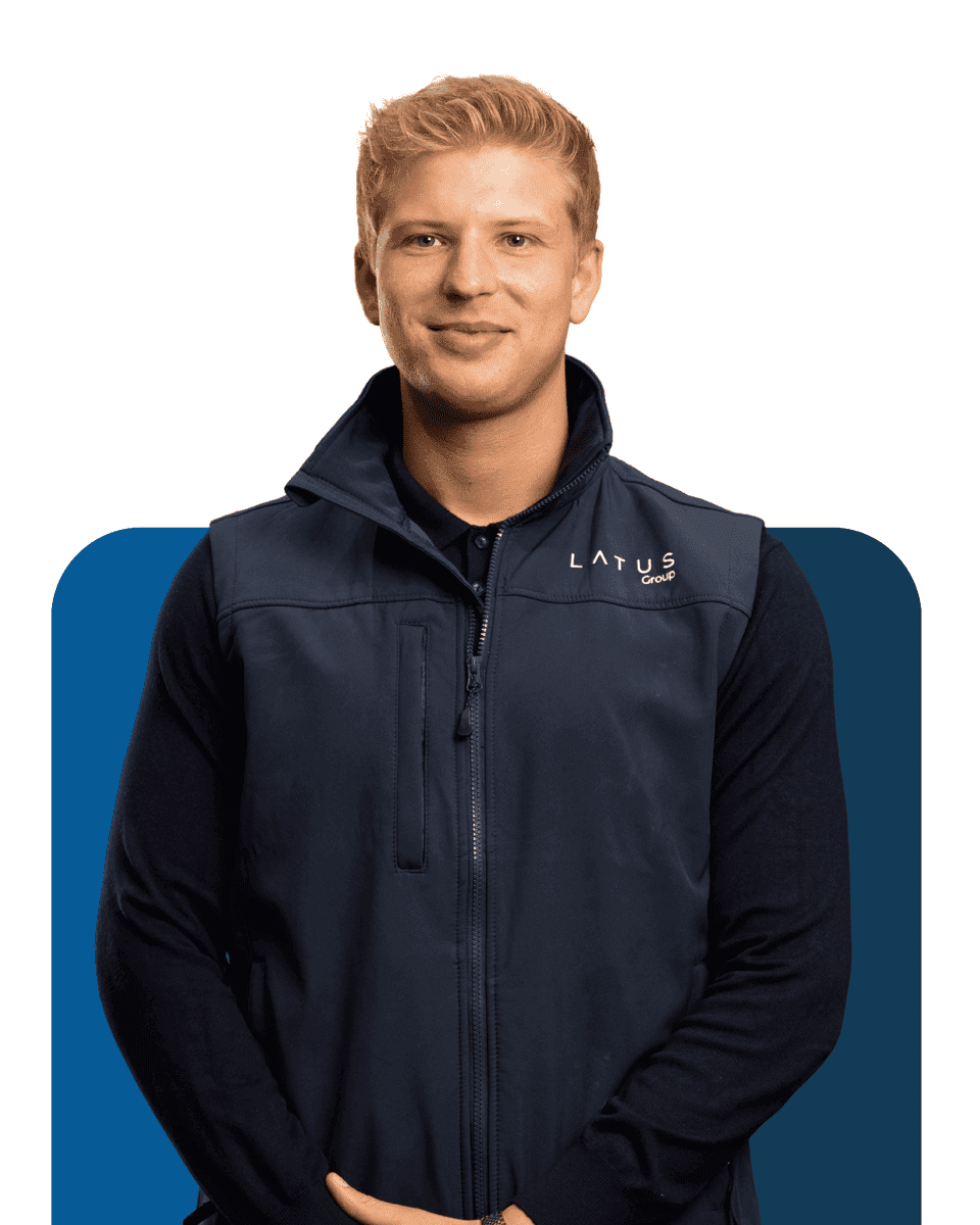 LATUS Group team member in company uniform, smiling confidently.