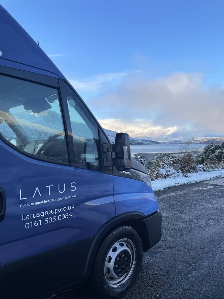 LATUS Group delivery van in snowy landscape.