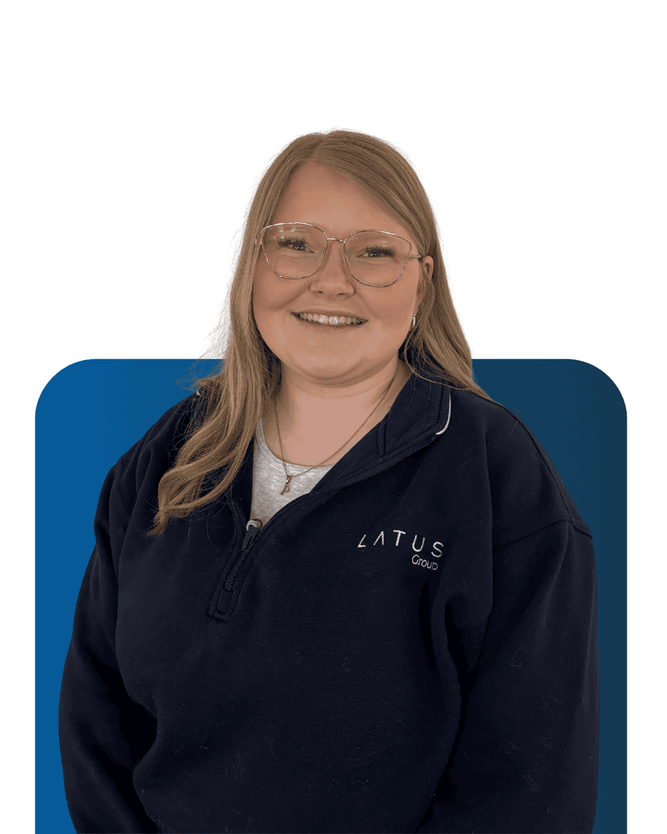 Team member at LATUS Group smiling in company apparel.