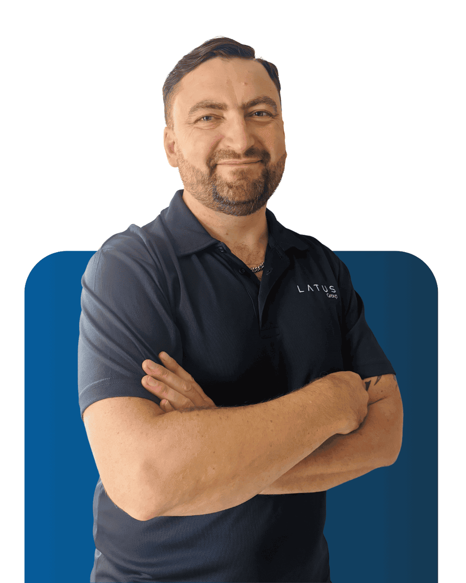 Professional team member at LATUS Group, showcasing expertise and confidence.