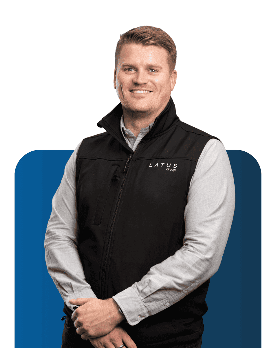 Professional team member at LATUS Group smiling confidently.