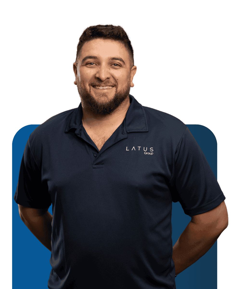LATUS Group team member smiling in company polo shirt.