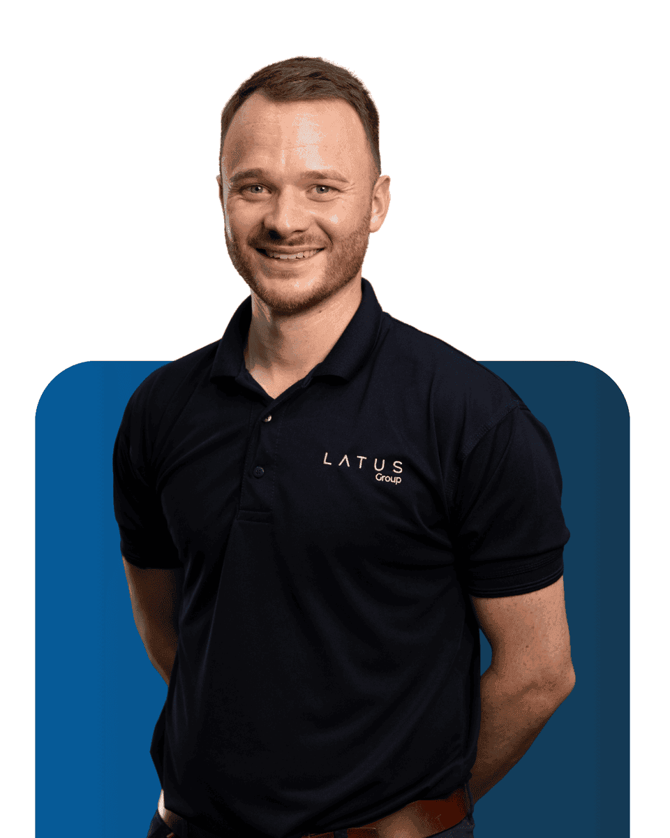 Professional team member of LATUS Group smiling in company polo shirt.