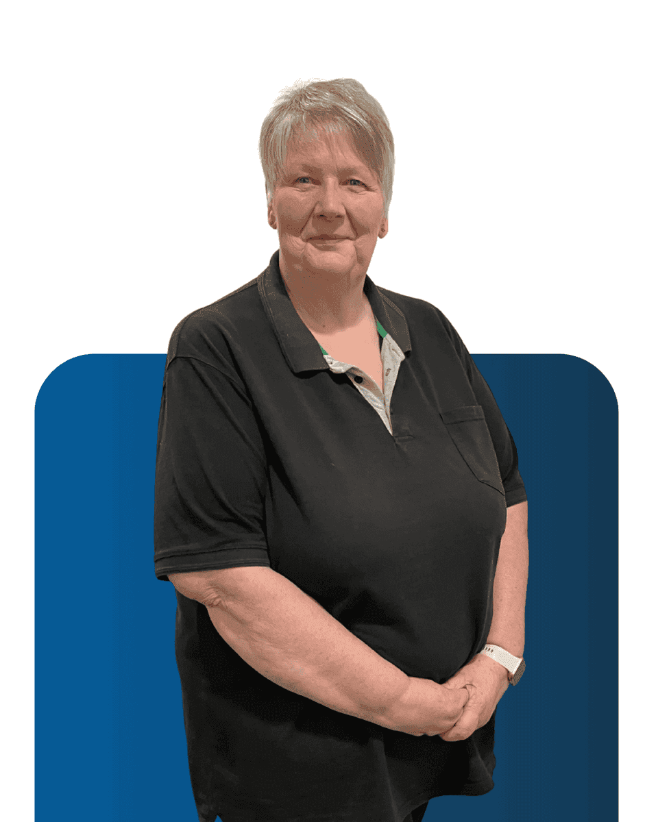 Senior woman team member at LATUS Group, smiling confidently.