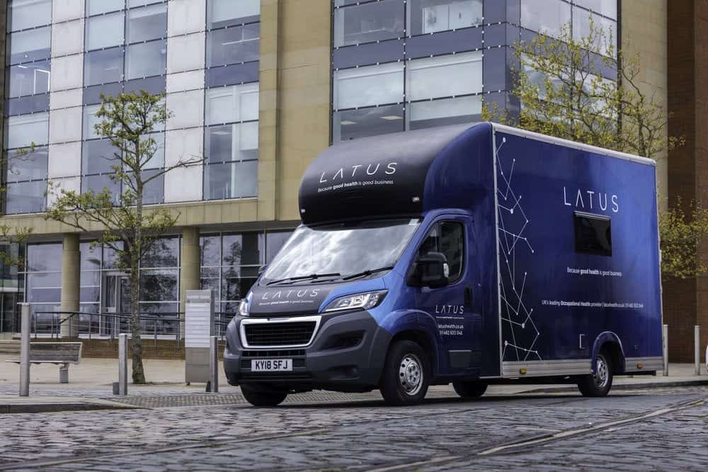 Mobile health unit van by LATUS Group providing mobile healthcare services.