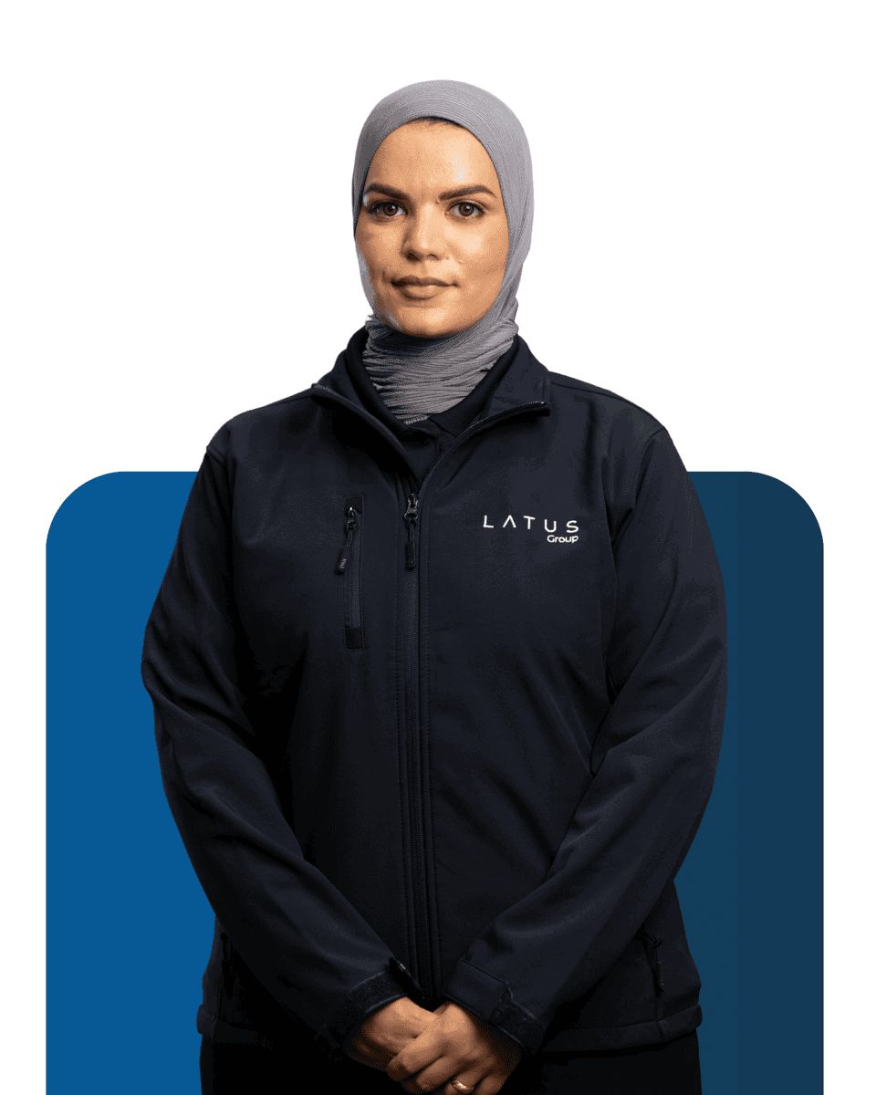 Professional woman in LATUS Group jacket for Meet the Team.