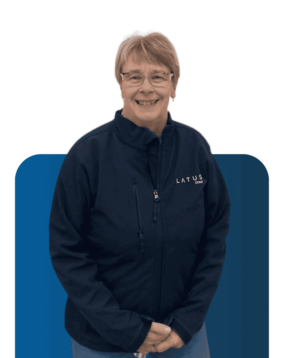 Senior team member at LATUS Group in professional work attire.