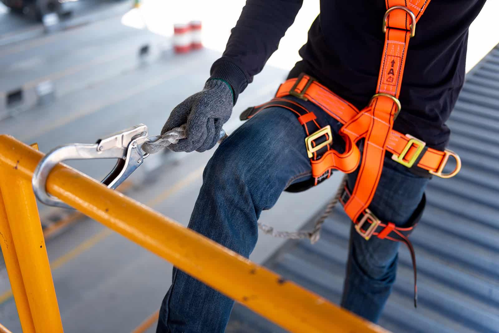 Safe working at height with professional harness and fall protection equipment.