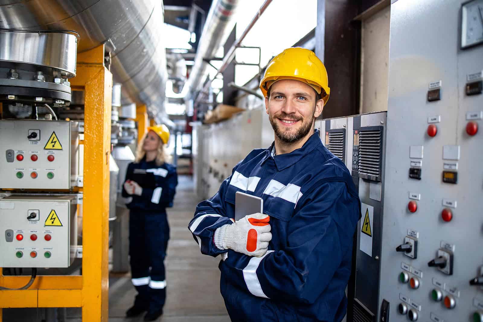 Electrician performing electrical maintenance in a medical manufacturing plant.