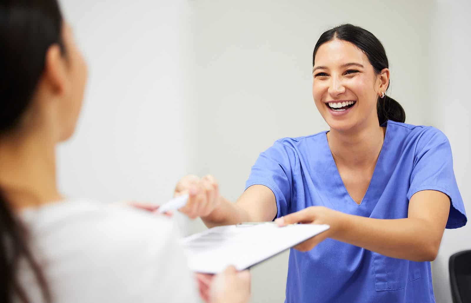 Healthcare professional discussing biological monitoring with patient.