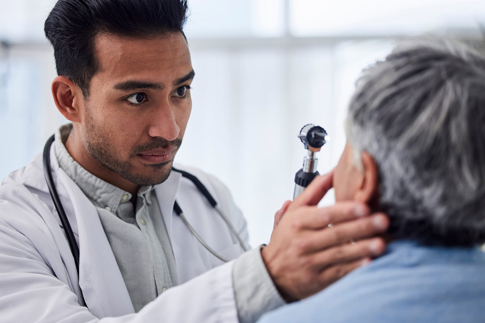 Healthcare professional conducting a vision assessment for health surveillance.