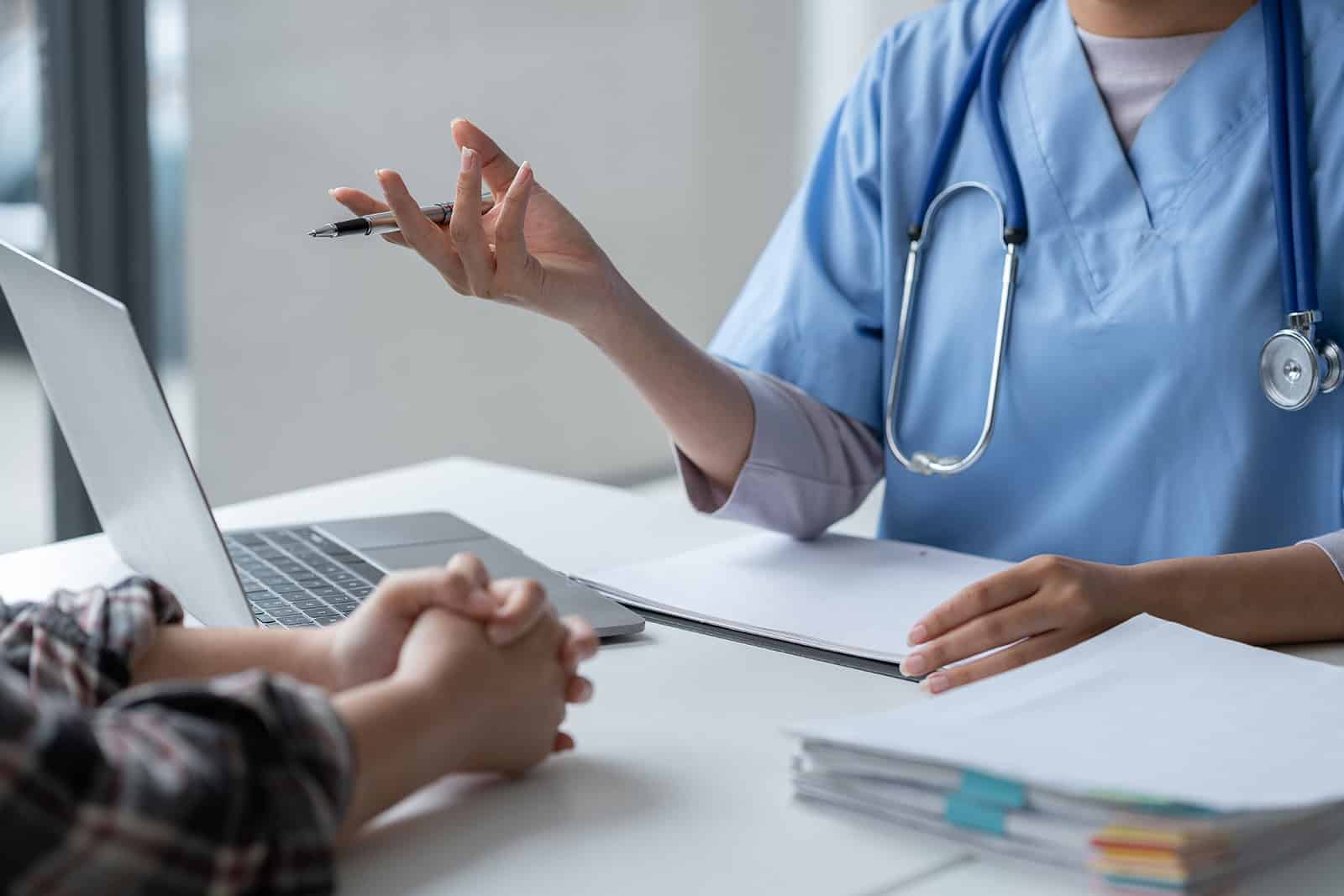 Healthcare professional discussing occupational health with patient.