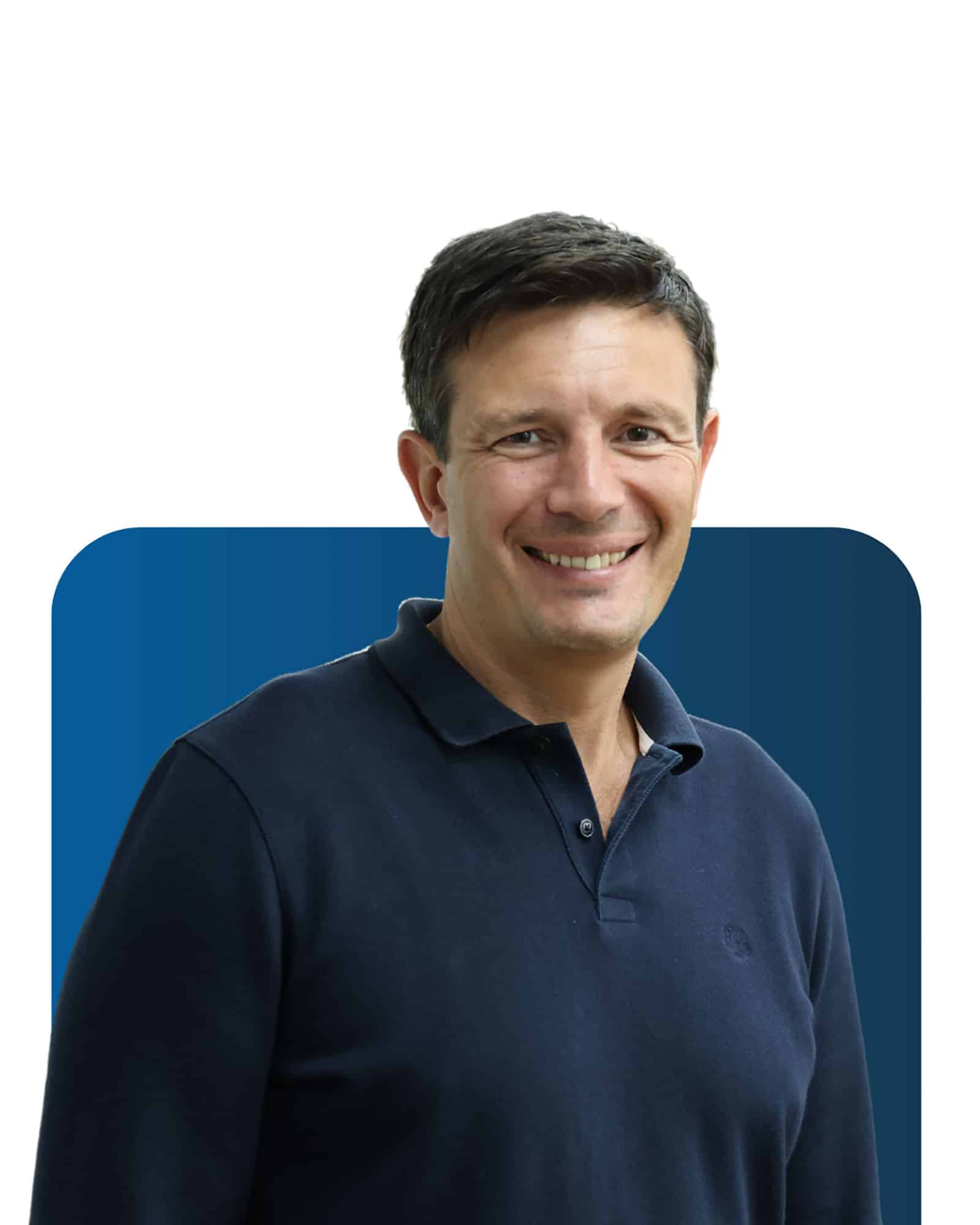 Professional team member at LATUS Group, smiling confidently.