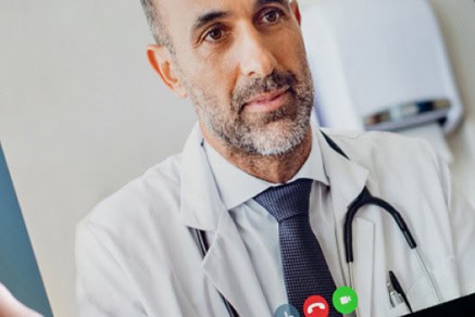 Doctor using YODHA app for patient communication and management.