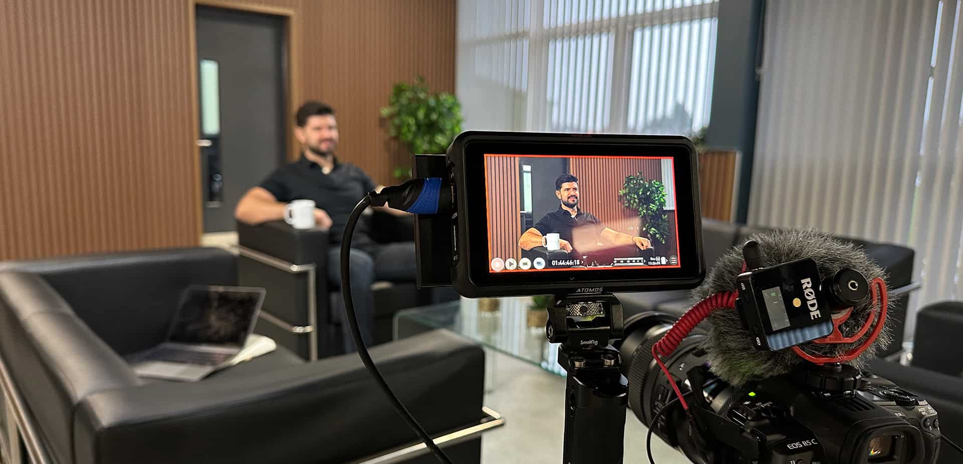 Jack Latus speaking during a corporate interview at LATUS Group headquarters.