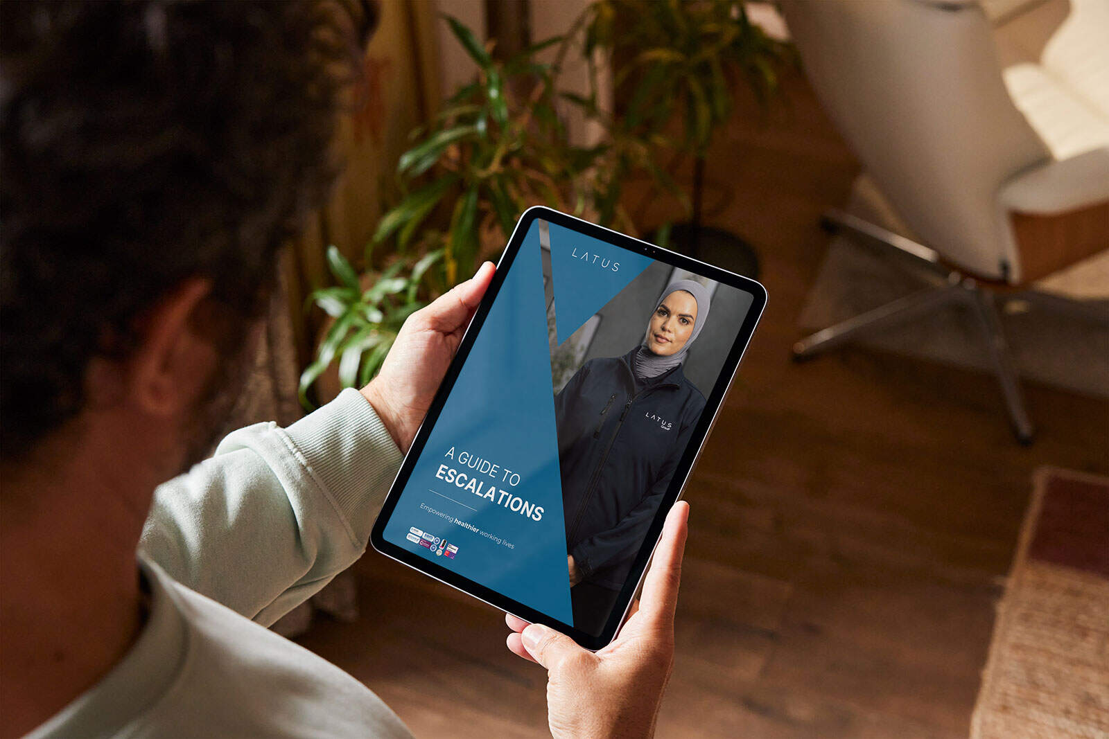 Digital tablet displaying Exec Medical guide by LATUS Group.