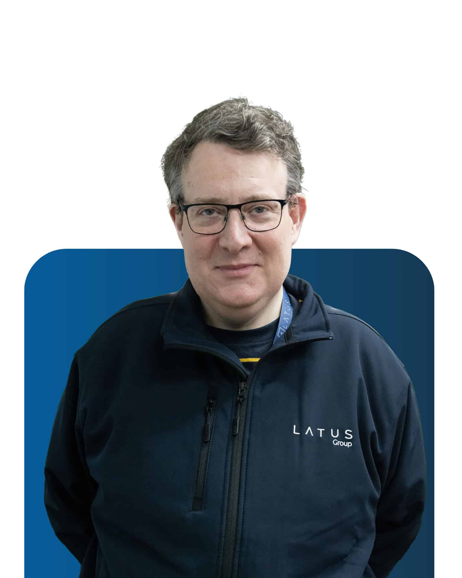 Professional team member at LATUS Group in casual work attire.