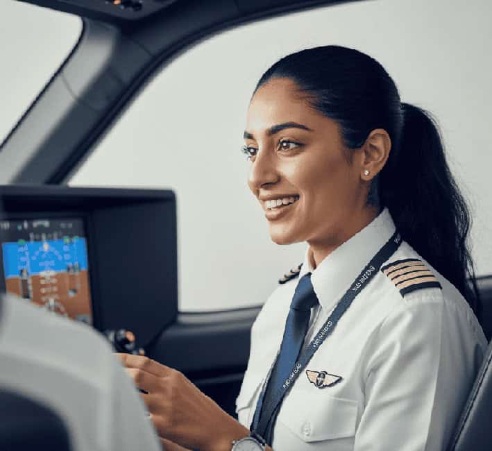 Aviation pilot training professional in cockpit, focusing on safety and skills.