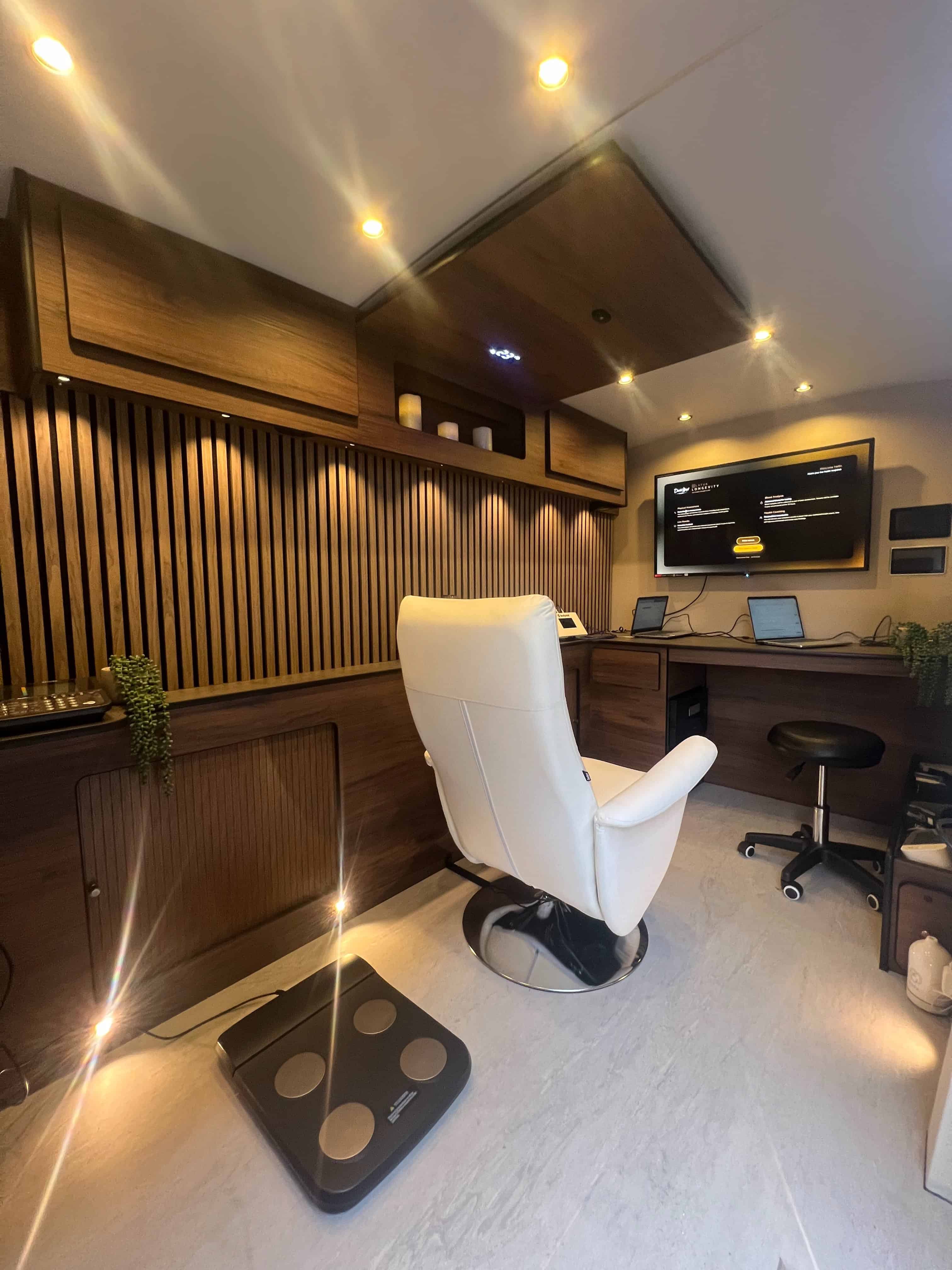 Modern wellness consultation room with digital health tools.