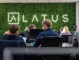 Business meeting at LATUS Group office with team working together.