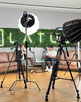 Studio setup with cameras and lighting for video recording at LATUS Group.