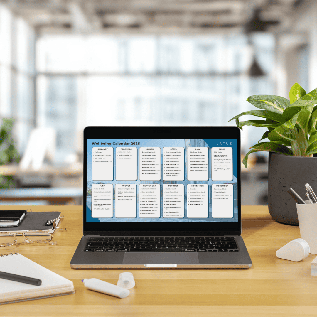 Digital wellbeing calendar displayed on a laptop screen in an office setting.