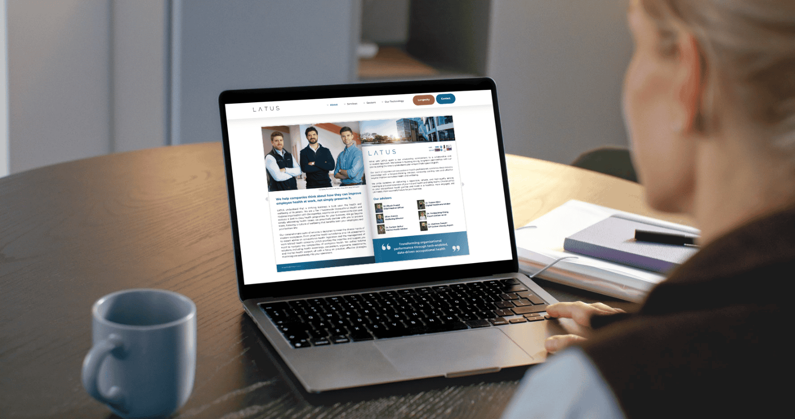LATUS Group branding on a laptop screen at a desk in Hull KR landing page.