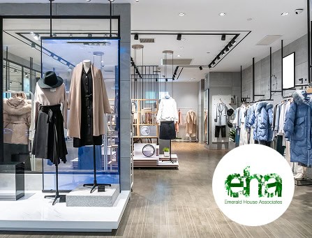 Mannequins showcasing stylish clothing in a contemporary retail store setting.