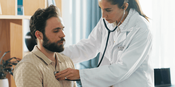 Healthcare professional conducting a pre-placement health assessment.