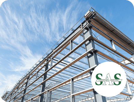 Steel building framework with clear blue sky background.